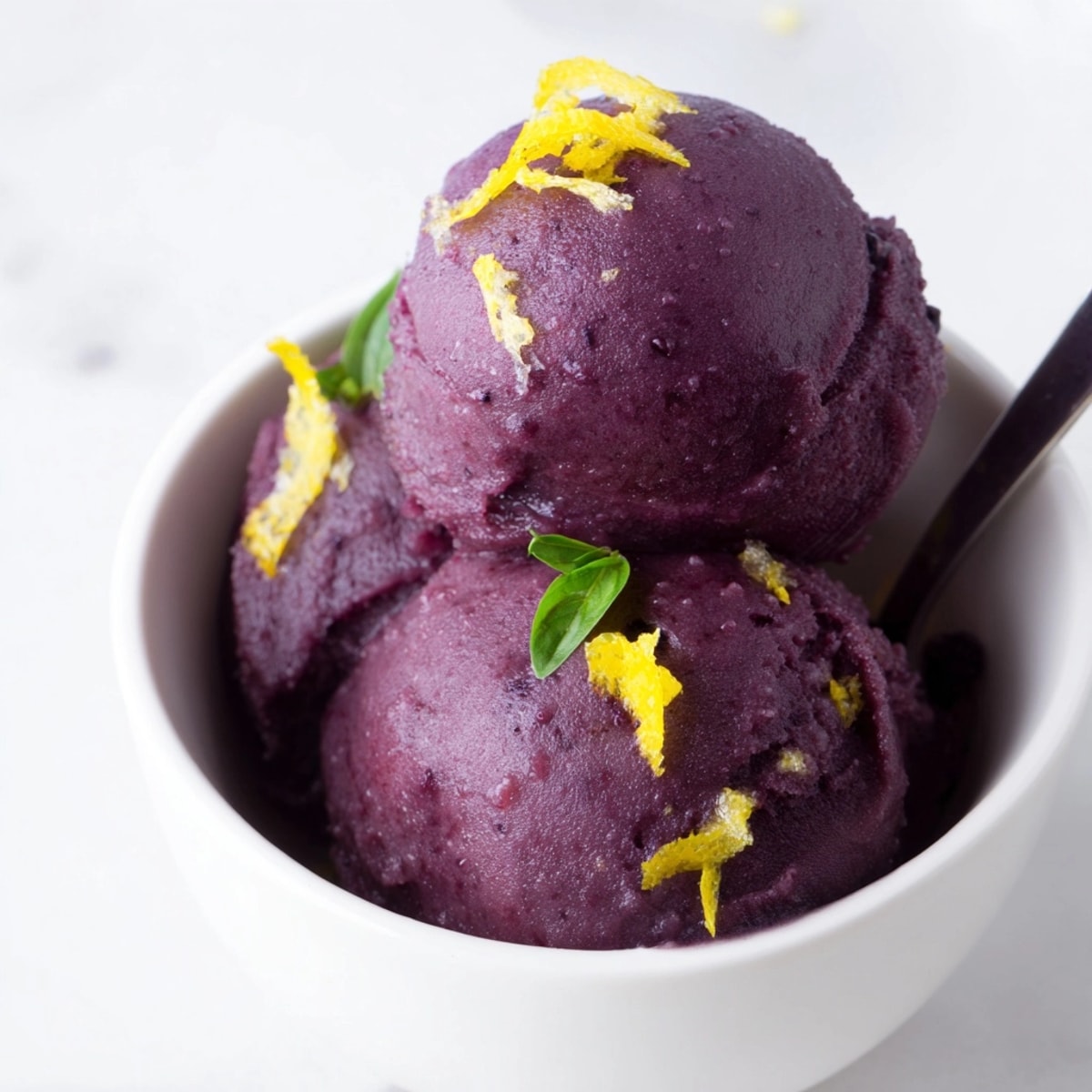 Refreshing Blueberry &amp; Basil Lemonade Sorbet: A naturally sweet, zesty summer dessert.