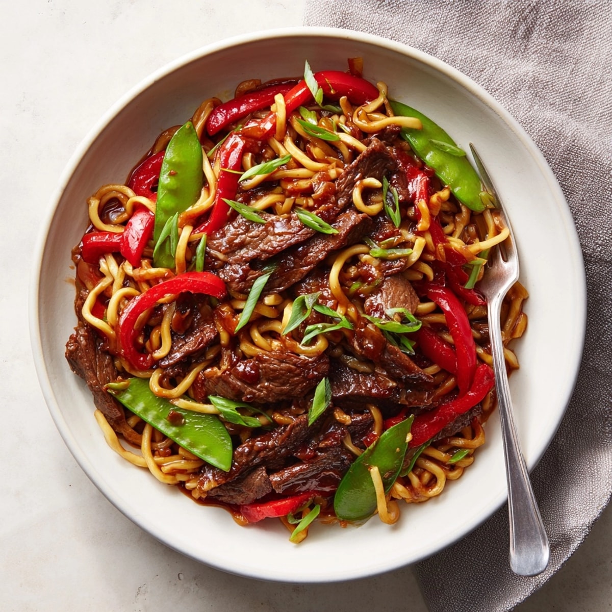 Homemade Mongolian Beef Noodles recipe: Chewy noodles, succulent beef, coated in a sweet-savory sauce.