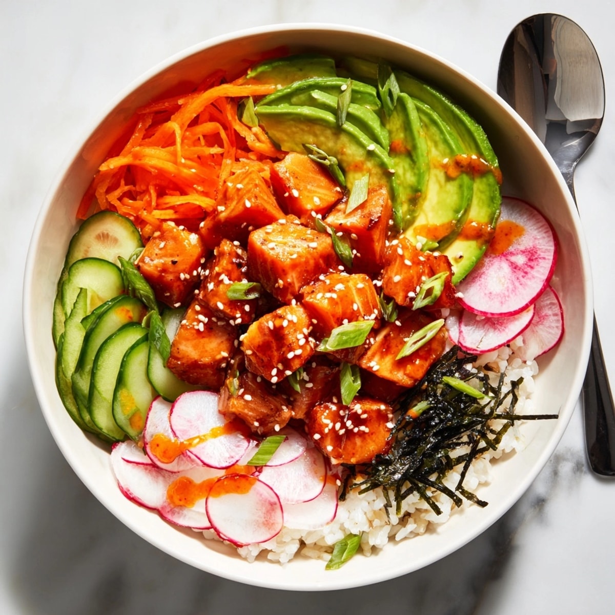 Bright, fresh Spicy Salmon Poke Bowl recipe with avocado, sesame, and crispy nori.