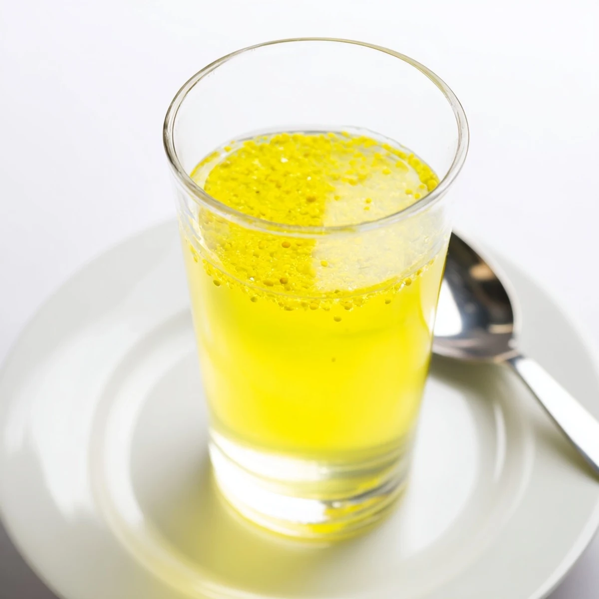 Crystal clear Lemon Juice, a zesty and vibrant kitchen staple, full of tangy, delicious flavor.