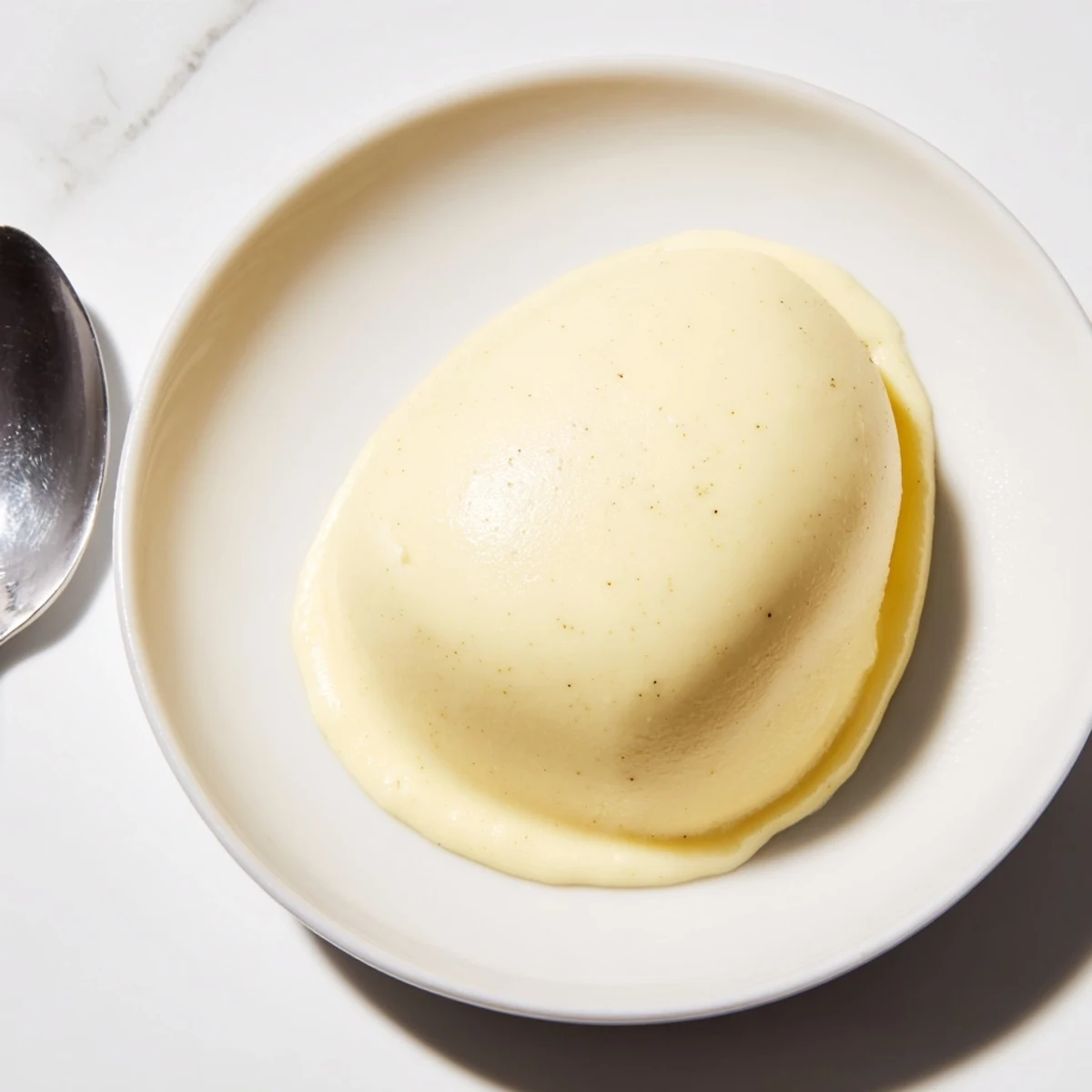 Warm, creamy custard boasts a smooth, luscious texture, best served with fresh berries atop.