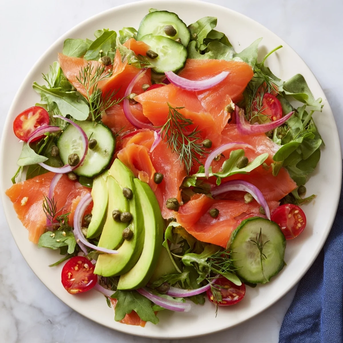 Vibrant Smoked Salmon Salad with Avocado, drizzled with lemon-dill dressing, ready to enjoy.