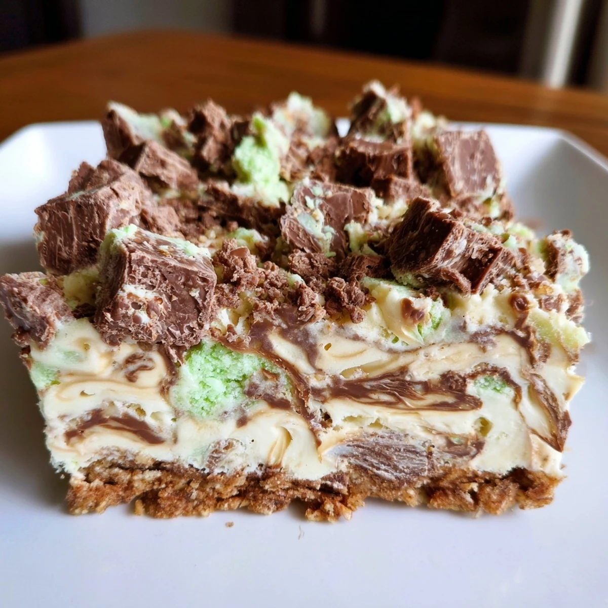Close-up of a refreshing Peppermint Crisp Slice, showcasing layers of creamy caramel and minty chocolate.
