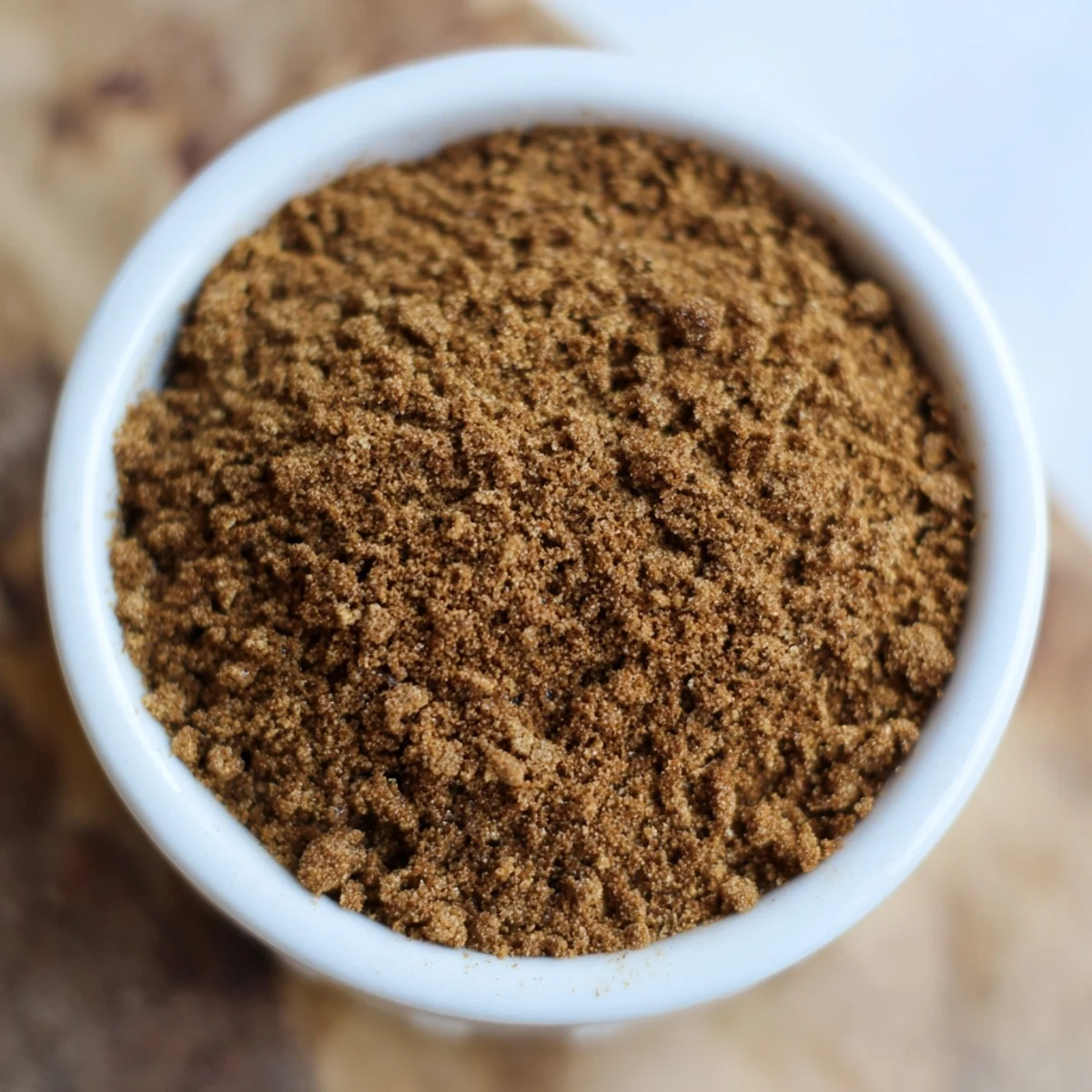 Vibrant photo of gingerbread spices: a freshly mixed spice blend, perfect for holiday baking.