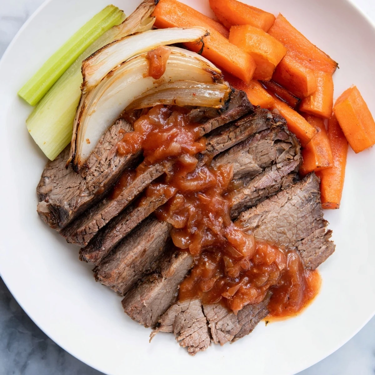 Tender slow cooked brisket, fork-tender and surrounded by vibrant vegetables and rich juices.