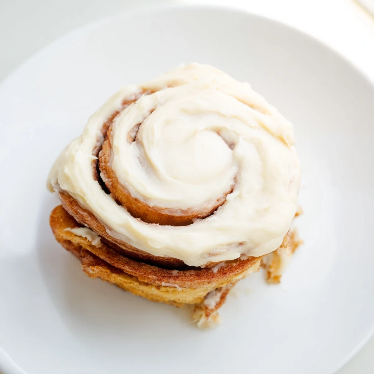 Warm Keto Cinnamon Buns served with a cup of coffee for a cozy, indulgent low-carb treat.