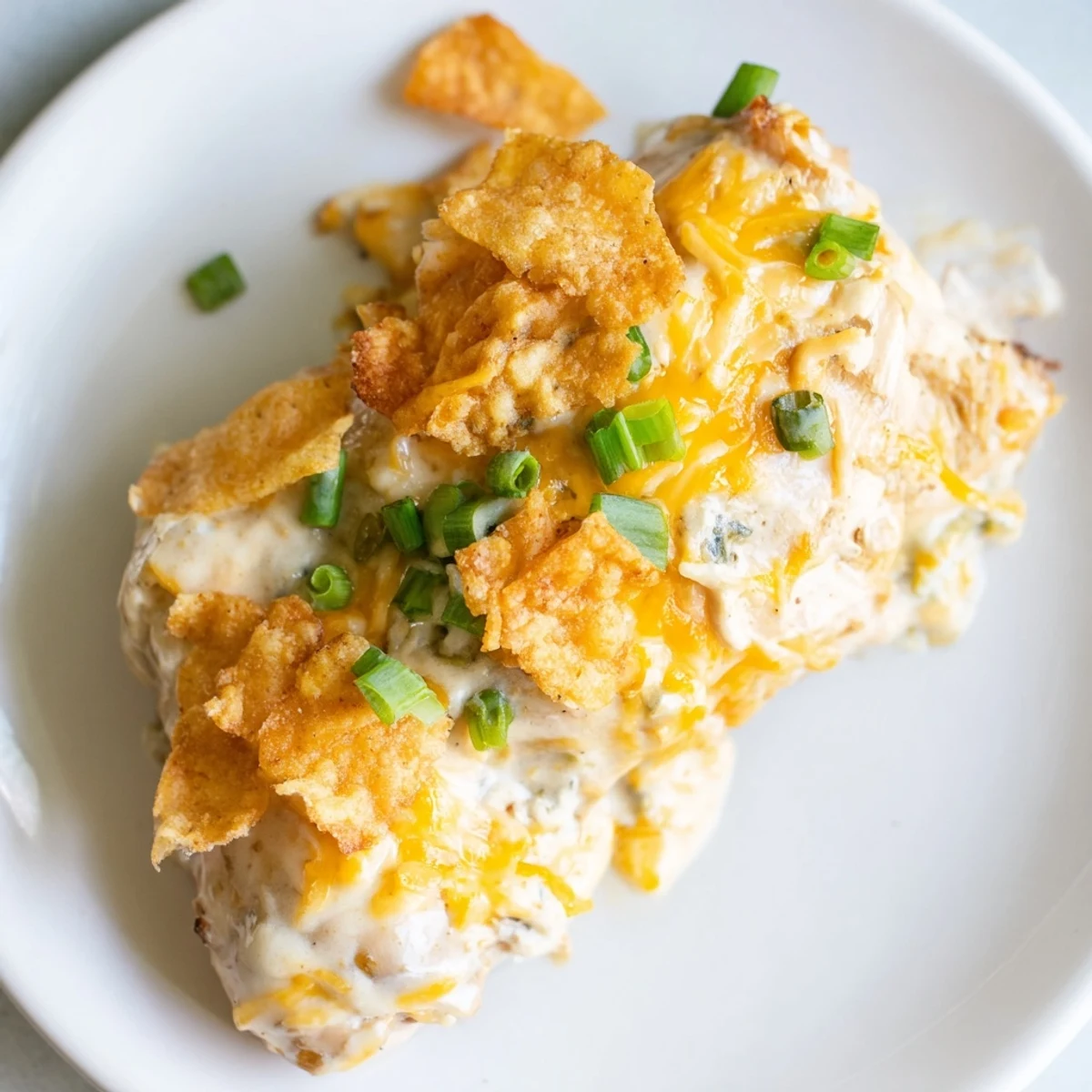 A serving of Sour Cream and Onion Chicken paired with fluffy white rice and steamed green beans for a complete dinner.