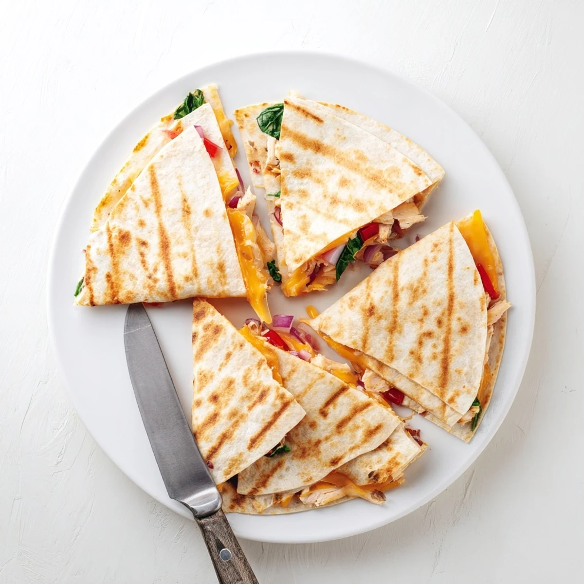 Mouthwatering chicken ranch quesadilla oozing melted cheddar and mozzarella over a cast iron skillet