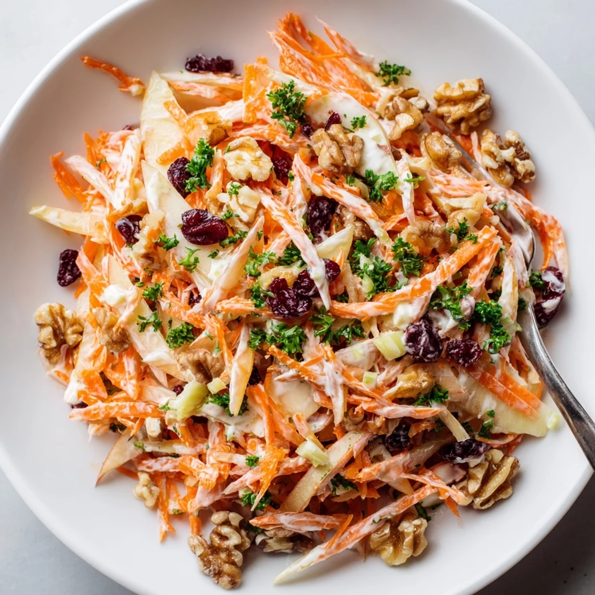 Crunchy Apple Carrot Salad With Creamy Citrus Dressing tossed with walnuts, crisp and tangy