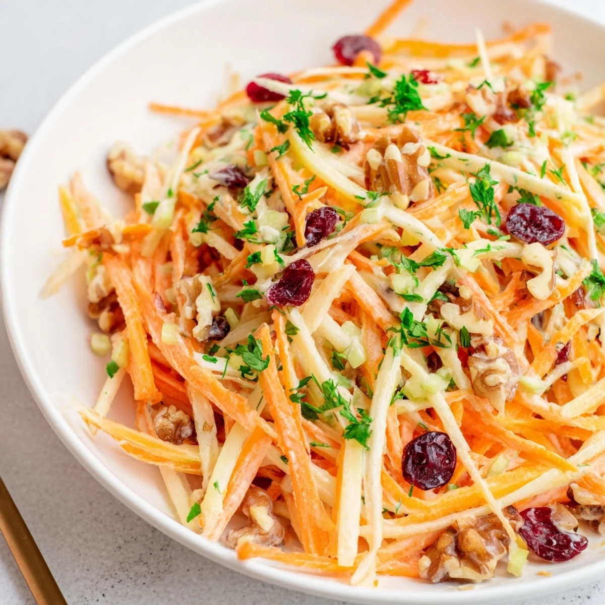 Crunchy Apple Carrot Salad With Creamy Citrus Dressing served chilled as refreshing side