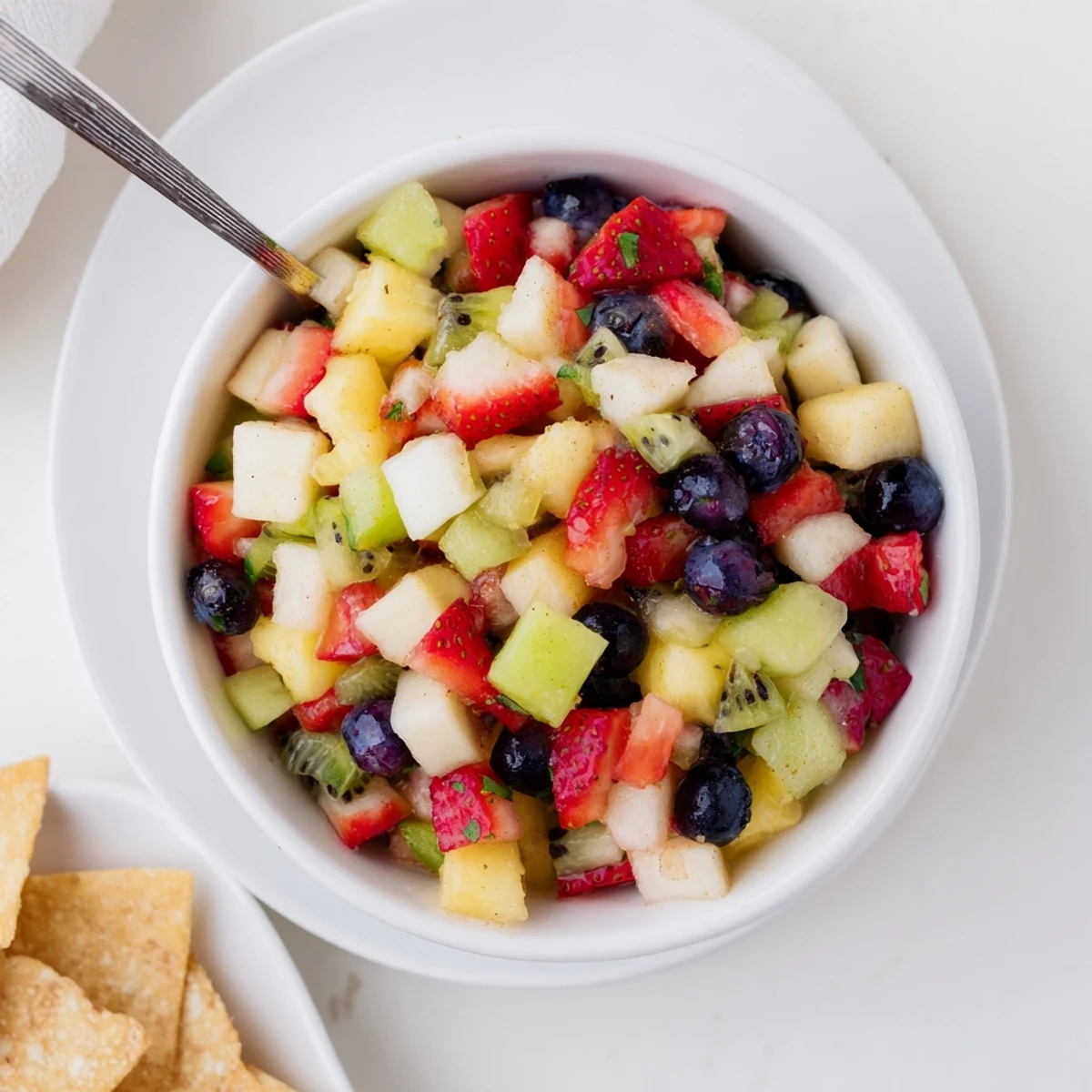 Fruit Salsa With Cinnamon Sugar Tortilla Chips served chilled, tangy fruit and warm chips
