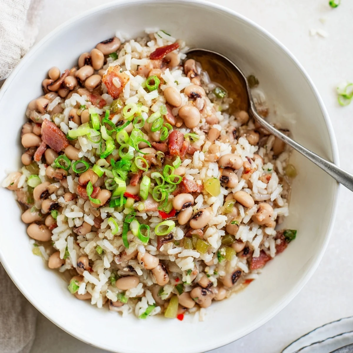 Steaming Hearty Smoky Southern Hoppin John ladled over fluffy rice.  