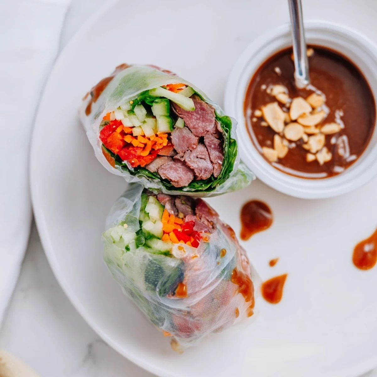 Handheld Thai Basil Beef Rolls showing fragrant basil, crisp cucumber, juicy beef