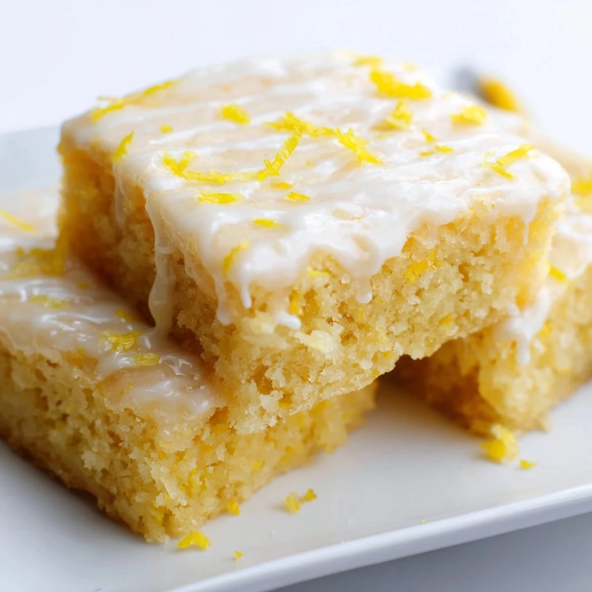 Fudgy lemon zest brownies with bright citrus flavor and cracked surface