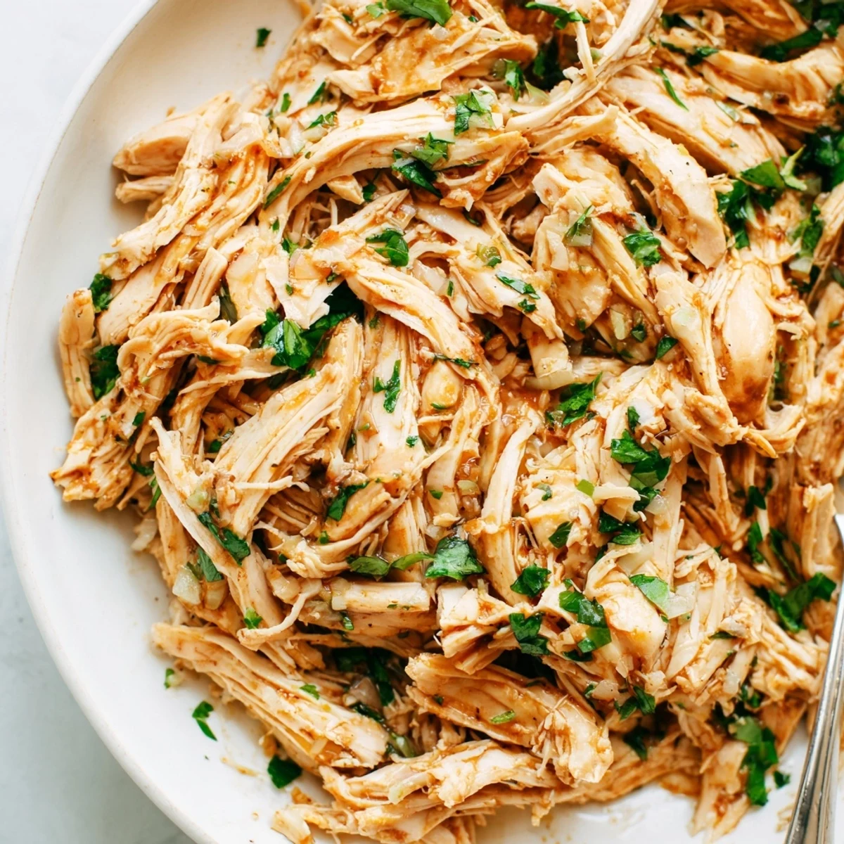 Slow Cooker Cilantro Lime Chicken piled in warm tortillas, zesty lime aroma