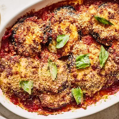 Hearty Charred Aubergine Parmigiana served with crusty bread and a fresh green salad for a complete meal.