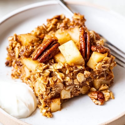 Warm slices of Delicious Apple Cinnamon Oatmeal Bake Recipe For Mornings with cinnamon sugar